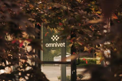Omnivet front door featuring the clinic’s logo on the window, welcoming pet parents seeking emergency and urgent care for their pets in Traverse City.