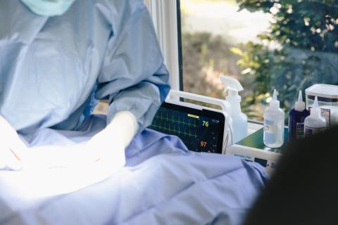 Omnivet veterinarian performing surgery with a full suite of human-grade anesthetic monitoring equipment, ensuring the highest standard of safety and care for pets in emergency and urgent procedures.
